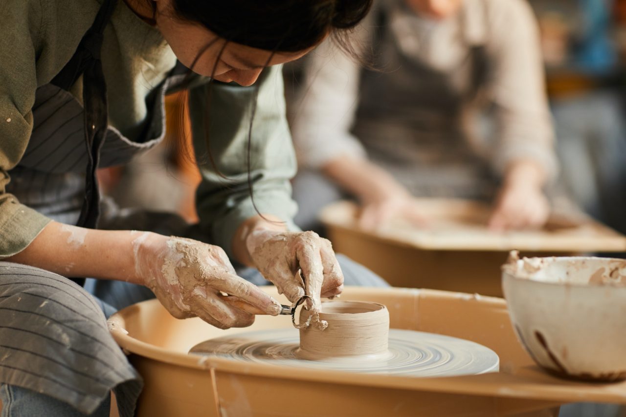 Hands-on pottery wheel moment during a date in Hanoi